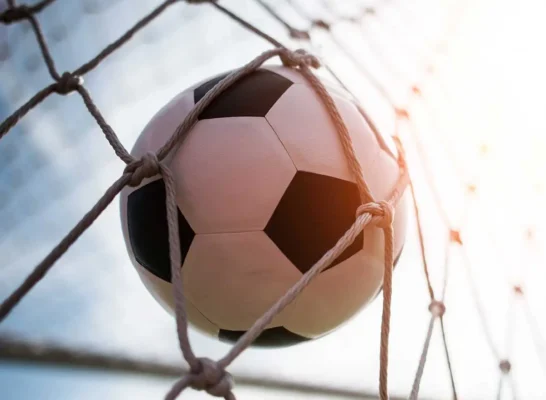 soccer ball hitting the back of the net